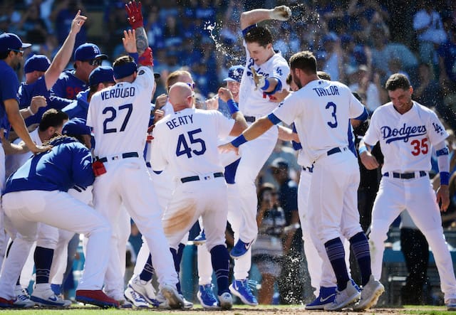 Matt Beaty, Cody Bellinger, Chris Taylor and Alex Verdugo celebrate after a Los Angeles Dodgers walk-off win