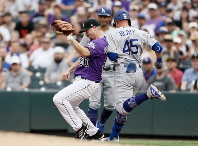 Los Angeles Dodgers infielder Matt Beaty makes it safely to first base against the Colorado Rockies