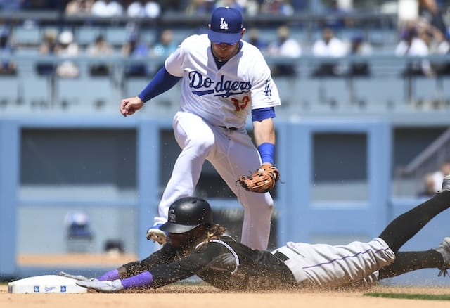 Los Angeles Dodgers infielder Max Muncy fields a throw to second base