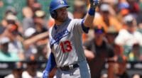 Los Angeles Dodgers infielder Max Muncy points at San Francisco Giants pitcher Madison Bumgarner after hitting a home run