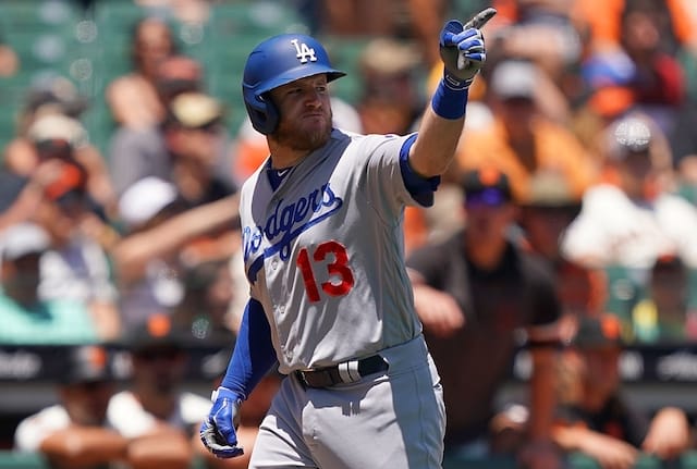 Los Angeles Dodgers infielder Max Muncy points at San Francisco Giants pitcher Madison Bumgarner after hitting a home run