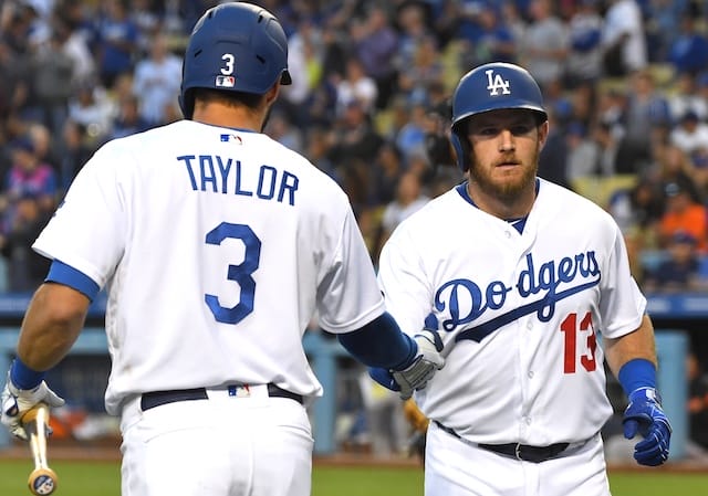 Los Angeles Dodgers shortstop Chris Taylor congratulates Max Muncy after a home run