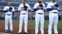 Los Angeles Dodgers manger Dave Roberts on the field with Max Muncy, Joc Pederson and Justin Turner before a 2018 World Series game