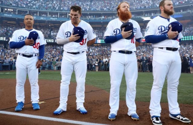 Los Angeles Dodgers manger Dave Roberts on the field with Max Muncy, Joc Pederson and Justin Turner before a 2018 World Series game