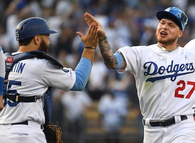 Russell Martin and Alex Verdugo celebrate after the Los Angeles Dodgers defeat the Chicago Cubs