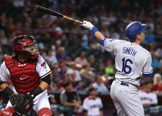 Los Angeles Dodgers catcher Will Smith hits a home run against the Arizona Diamondbacks
