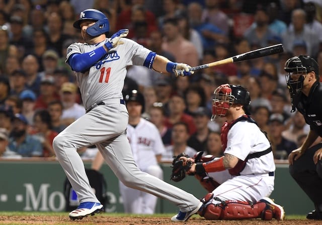 Los Angeles Dodgers center fielder A.J. Pollock hits an RBI single against the Boston Red Sox