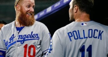 Los Angeles Dodgers teammates A.J. Pollock and Justin Turner in the dugout at Coors Field