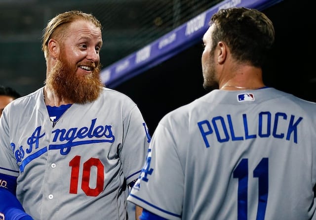 Los Angeles Dodgers teammates A.J. Pollock and Justin Turner in the dugout at Coors Field