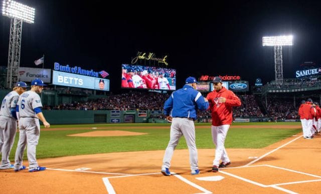 Los Angeles Dodgers manager Dave Roberts and Boston Red Sox manager Alex Cora greet one another before a 2018 World Series Game at Fenway Park