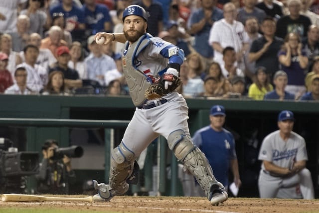 Los Angeles Dodgers catcher Russell Martin throws to first base