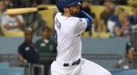 Los Angeles Dodgers shortstop Chris Taylor hits a triple against the Arizona Diamondbacks