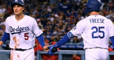 Los Angeles Dodgers teammates David Freese and Corey Seager celebrate during a game against the Cincinnati Reds