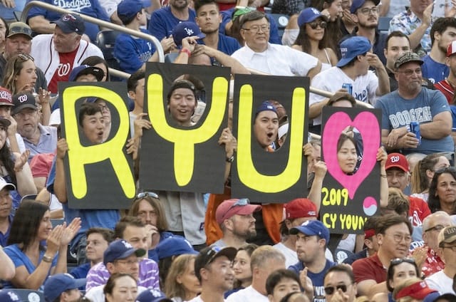Los Angeles Dodgers fans hold a Hyun-Jin Ryu sign
