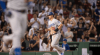 Los Angeles Dodgers outfielder Joc Pederson scores a run on a bases-loaded walk