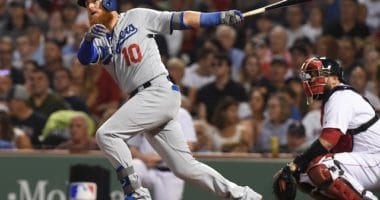 Los Angeles Dodgers third baseman Justin Turner hits a double against the Boston Red Sox