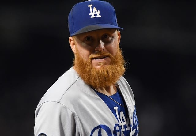 Los Angeles Dodgers third baseman Justin Turner looks into the dugout at Fenway Park