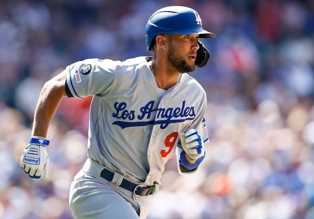 Los Angeles Dodgers infielder Kristopher Negrón rounds the bases after hitting a home run against the Colorado Rockies