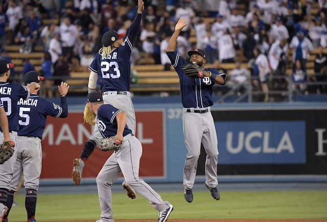 Manuel Margot and Fernando Tatis Jr. celebrate after the San Diego Padres defeat the Los Angeles Dodgers at Dodger Stadium