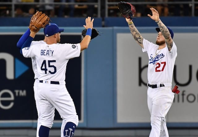 Outfielders Matt Beaty, Alex Verdugo celebrate after a Los Angeles Dodgers win