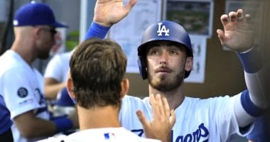 Cody Bellinger is congratulated by Clayton Kershaw in the Los Angeles Dodgers dugout