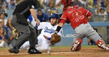 Los Angeles Dodgers first baseman Max Muncy is out at home plate