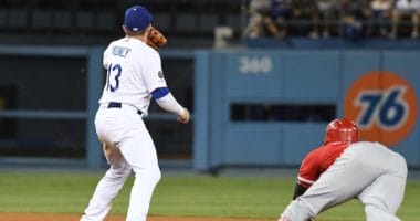 Los Angeles Dodgers infielder Max Muncy receives a throw at second base