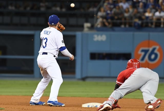 Los Angeles Dodgers infielder Max Muncy receives a throw at second base