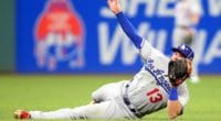Los Angeles Dodgers infielder Max Muncy makes a diving stop during the 2019 MLB All-Star Game at Progressive Field