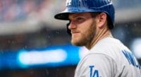 Los Angeles Dodgers infielder Max Muncy stands in the rain during a game at Citizens Bank Park