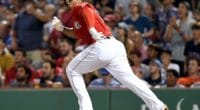 Boston Red Sox third baseman Rafael Devers hits a double against the Los Angeles Dodgers