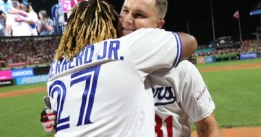 Toronto Blue Jays third baseman Vladimir Guerrero Jr. and Los Angeles Dodgers outfielder Joc Pederson embrace during the 2019 Home Run Derby at Progressive Field