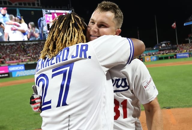 Toronto Blue Jays third baseman Vladimir Guerrero Jr. and Los Angeles Dodgers outfielder Joc Pederson embrace during the 2019 Home Run Derby at Progressive Field