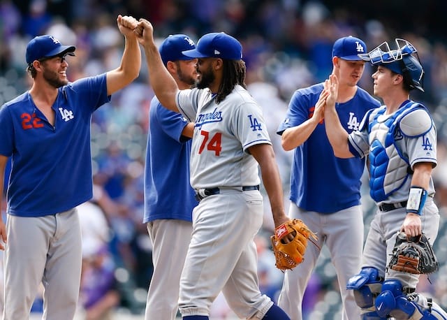 Walker Buehler, Rich Hill, Kenley Jansen, Clayton Kershaw and Will Smith celebrate after a Los Angeles Dodgers win against the Colorado Rockies
