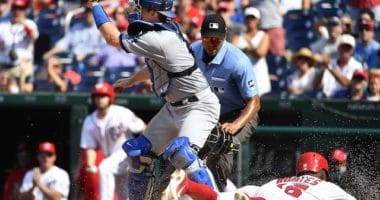 Los Angeles Dodgers catcher Will Smith receives a throw at home plate