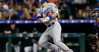 Los Angeles Dodgers catcher Will Smith hits a double against the Colorado Rockies