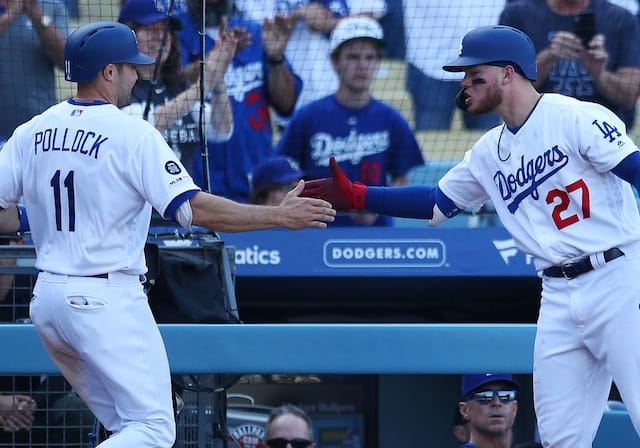 Los Angeles Dodgers outfielders A.J. Pollock and Alex Verdugo celebrate at Dodger Stadium