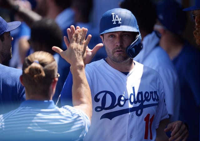 Los Angeles Dodgers center fielder A.J. Pollock is congratulated in the dugout