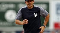 New York Yankees manager Aaron Boone runs off the field at Yankee Stadium