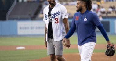 Los Angeles Dodgers closer Kenley Jansen walks off the field with Anthony Davis after he threw out the first pitch on Lakers Night at Dodger Stadium