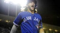 Toronto Blue Jays shortstop celebrates after hitting a home run off Los Angeles Dodgers pitcher Clayton Kershaw