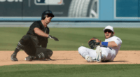 New York Yankees center fielder Brett Gardner slides into Los Angeles Dodgers infielder Max Muncy