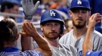 Los Angeles Dodgers All-Star Cody Bellinger congratulates Kyle Garlick in the dugout after a home run
