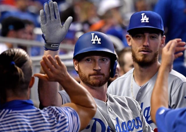 Los Angeles Dodgers All-Star Cody Bellinger congratulates Kyle Garlick in the dugout after a home run