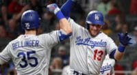 Los Angeles Dodgers teammates Cody Bellinger and Max Muncy celebrate after hitting a home run