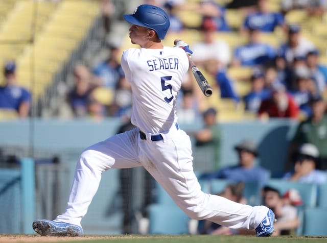 Los Angeles Dodgers shortstop Corey Seager reaches on an error