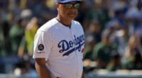 Los Angeles Dodgers manager Dave Roberts walks onto the field at Dodger Stadium