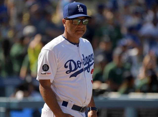 Los Angeles Dodgers manager Dave Roberts walks onto the field at Dodger Stadium