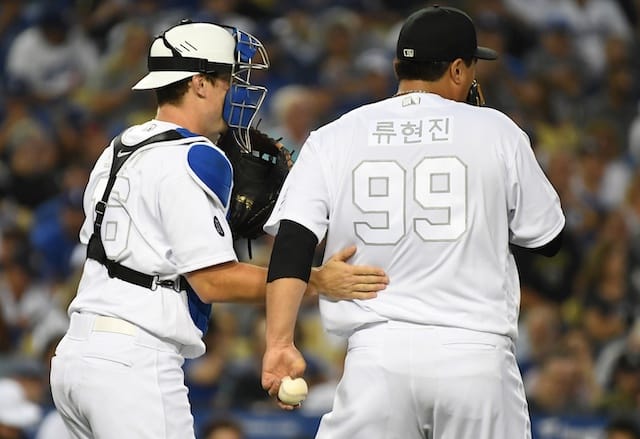 Los Angeles Dodgers catcher Will Smith has a mound visit with Hyun-Jin Ryu
