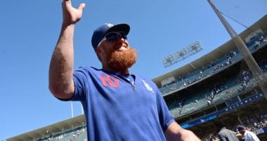Los Angeles Dodgers third baseman Justin Turner waves to fans at Dodger Stadium
